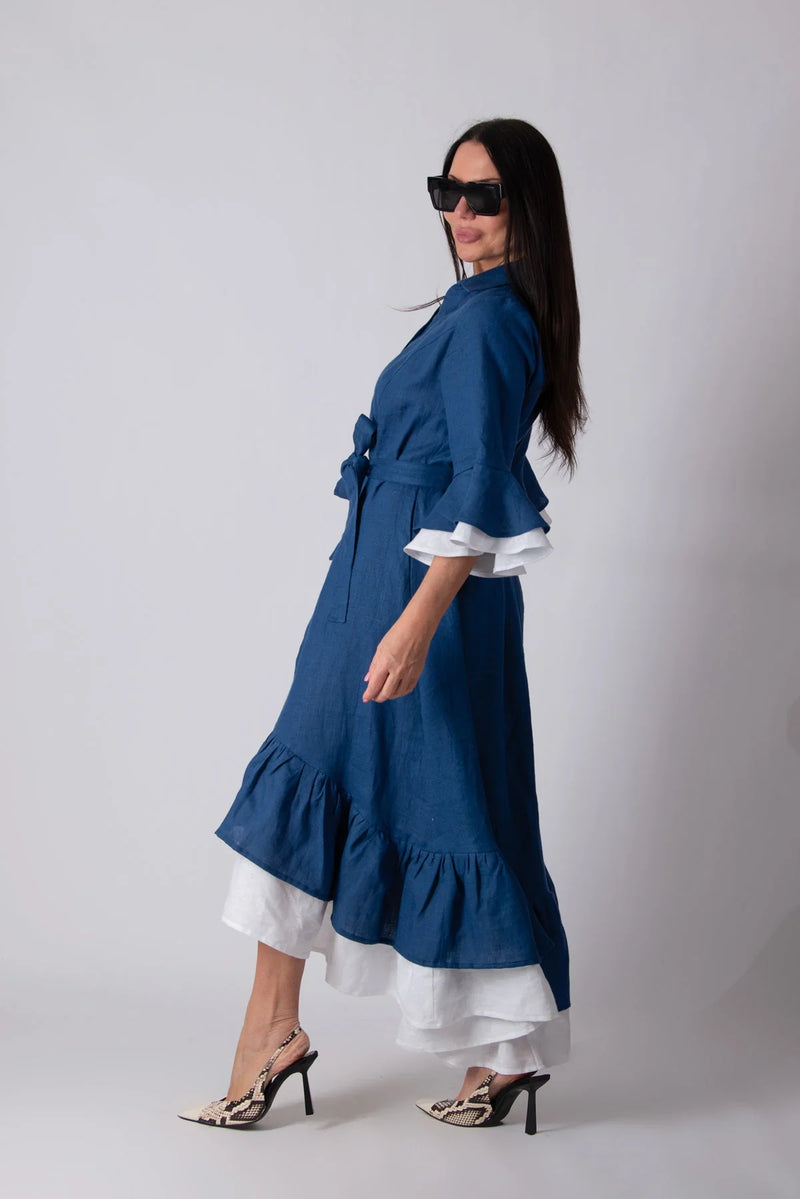 Side view of LINEN FLOUNCES DRESS SALEM, displaying the convenient side pockets for added functionality.