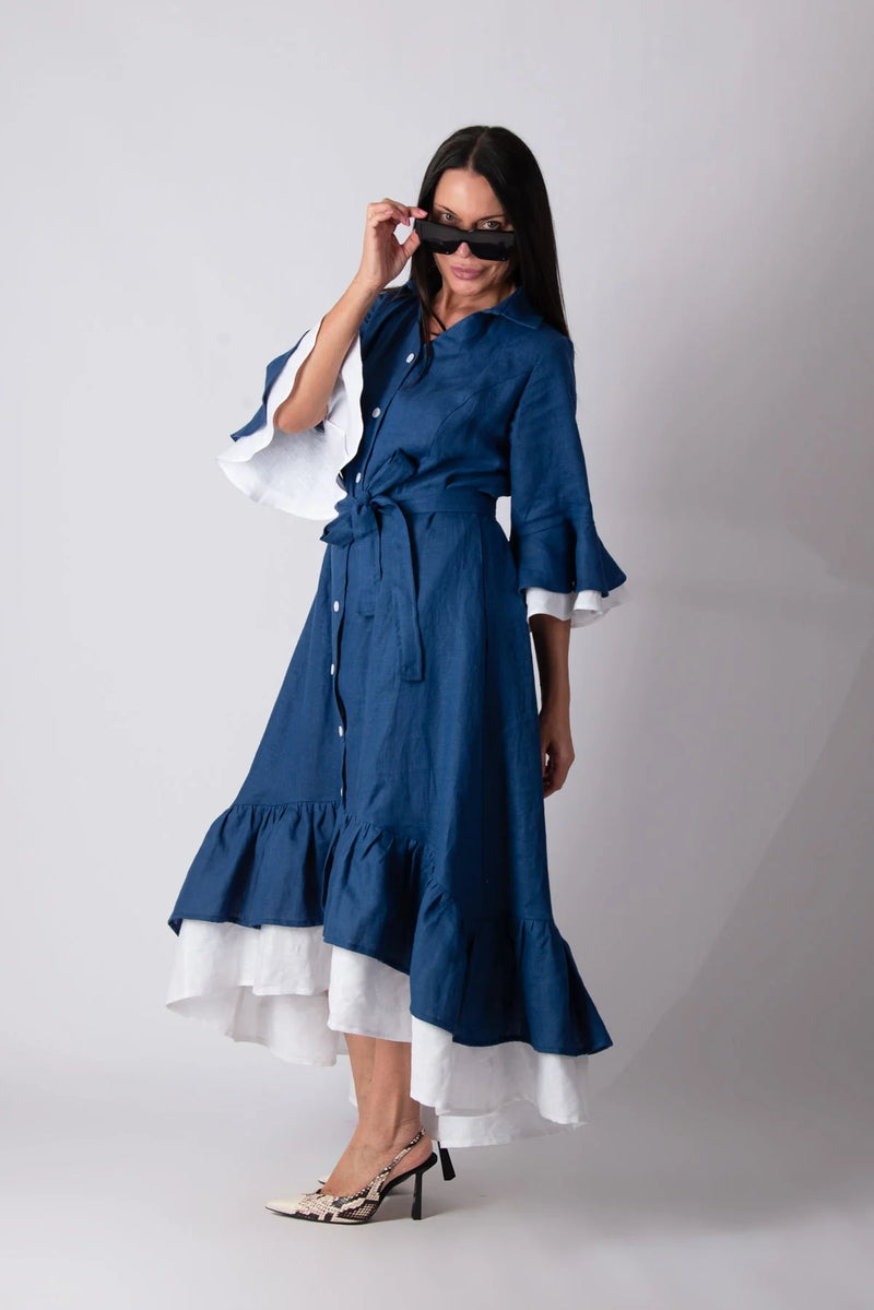 Side view of LINEN FLOUNCES DRESS SALEM, displaying the convenient side pockets for added functionality.
