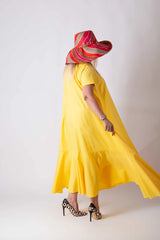 Summer Dress DIVA by DFold Clothing - Back view of the loose-fit cotton dress with stylish flounces.