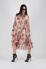 Image of a woman wearing a pink flounces summer dress from DFold Clothing's MARTINA 