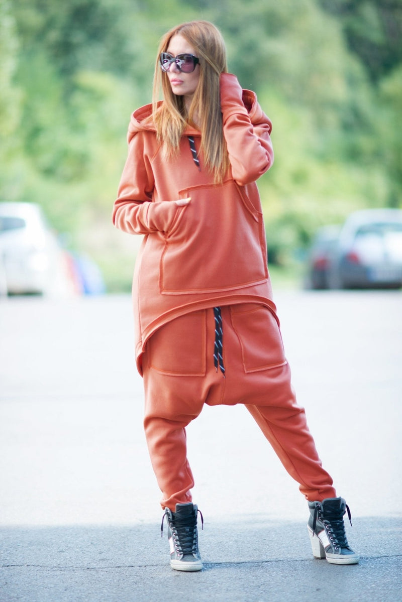 DFold Clothing presents the MEGAN Hooded Sports Outfit: A stylish and comfortable ensemble featuring an oversized hoodie, front pocket, and harem pants.