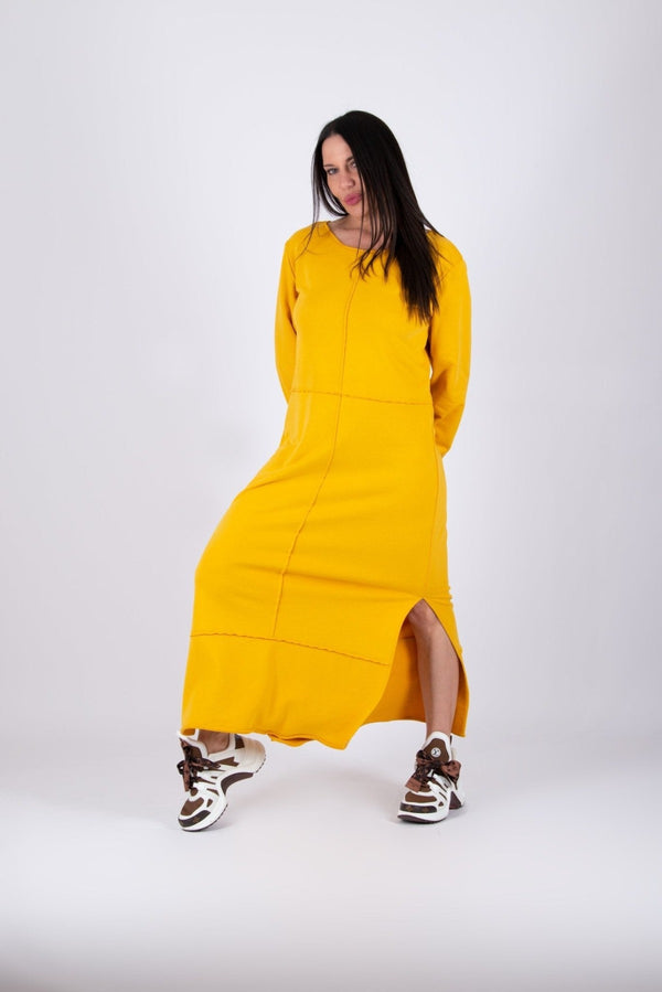 Long Dress GABRIELLE - Front View: Model wearing yellow cotton dress with raw edges and two side slits.
