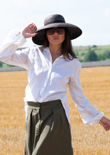 Close-up view of the fashion back detail with stripes on the JENNA Linen Shirt.