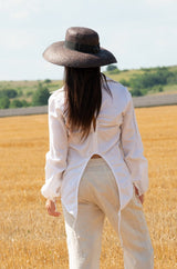 Back view of the JENNA Linen Shirt showcasing its long sleeves and relaxed fit.