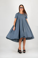 Model wearing the dress, highlighting the flattering A-line silhouette and short sleeves.