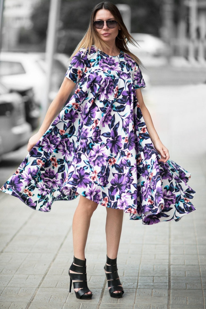 Model wearing the dress, highlighting the flattering A-line silhouette and short sleeves.
